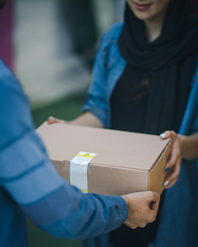 Courier delivering parcel last mile